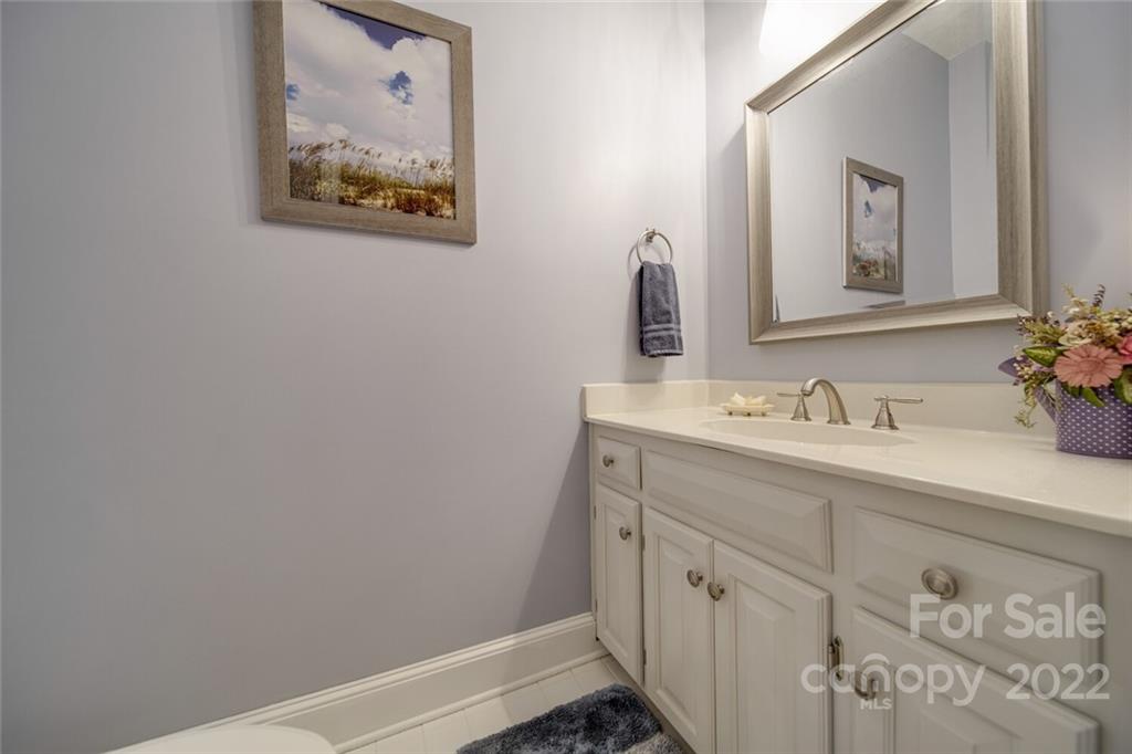 2700 Dutch Road Mount Pleasant, NC 28124 - Photo 19 of 48 a bathroom with a sink vanity and a mirror