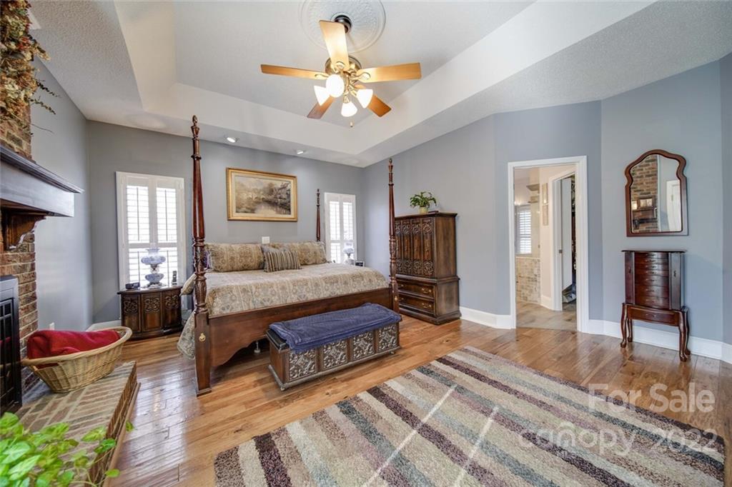2700 Dutch Road Mount Pleasant, NC 28124 - Photo 21 of 48 a spacious bedroom with a bed a dresser and potted plant