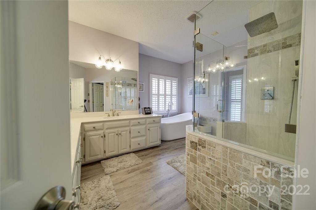 2700 Dutch Road Mount Pleasant, NC 28124 - Photo 23 of 48 a large bathroom with a double vanity sink a toilet a mirror and shower