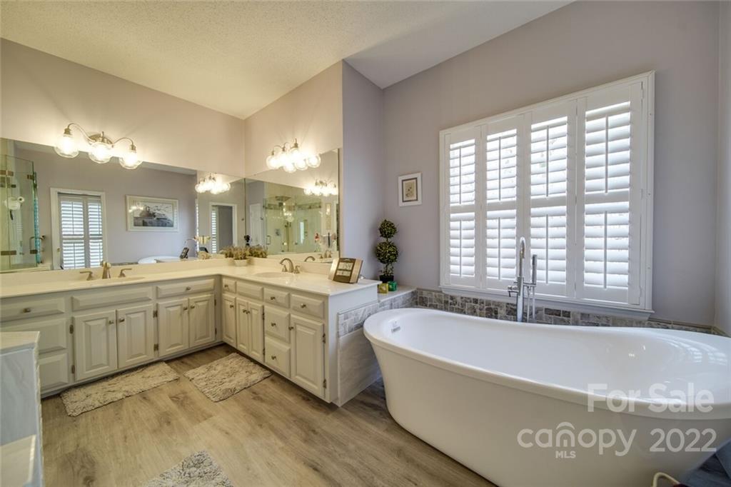 2700 Dutch Road Mount Pleasant, NC 28124 - Photo 24 of 48 a spacious bathroom with a tub double sink window and mirror