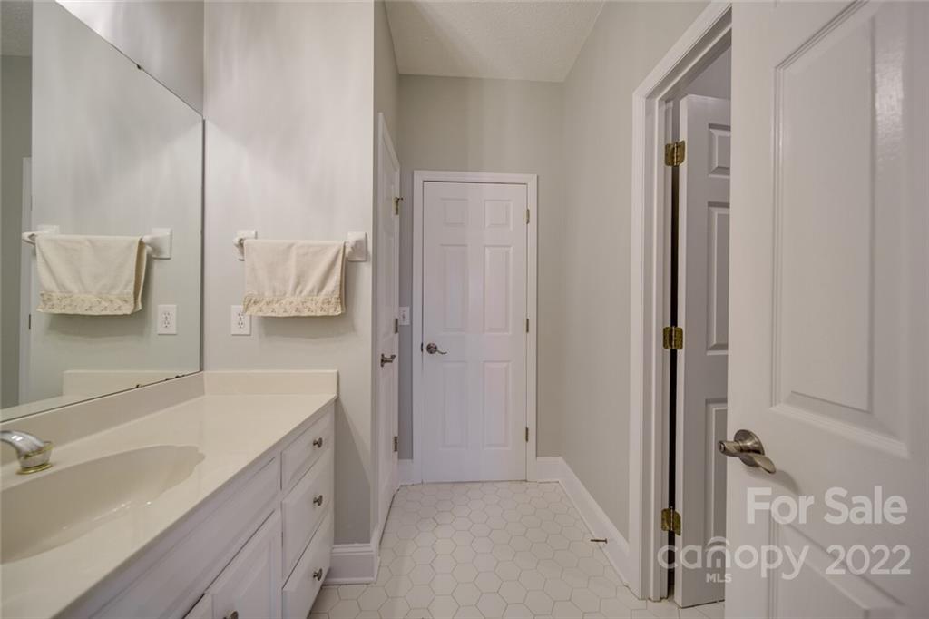 2700 Dutch Road Mount Pleasant, NC 28124 - Photo 32 of 48 a bathroom with a sink and a mirror