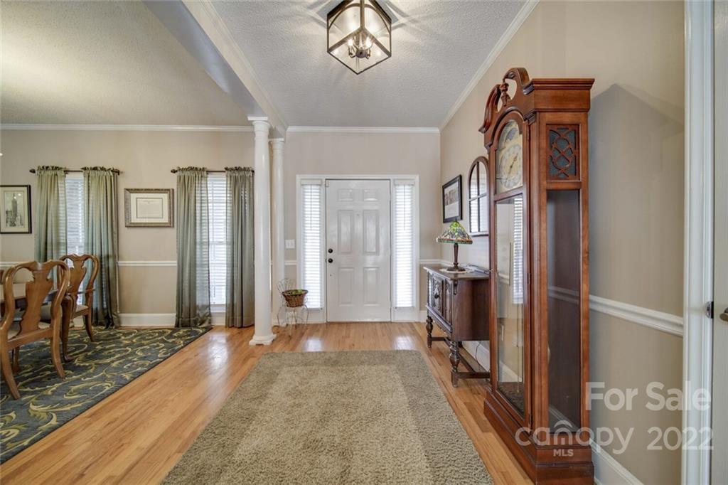 2700 Dutch Road Mount Pleasant, NC 28124 - Photo 5 of 48 a view of a hallway with wooden floor and a bathroom