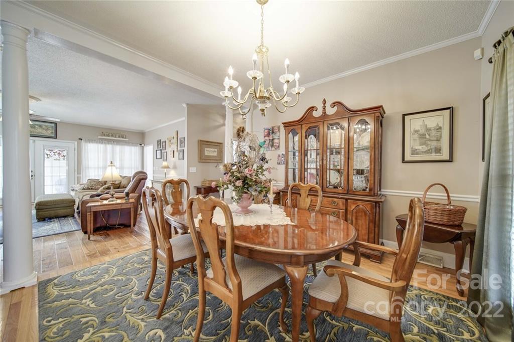 2700 Dutch Road Mount Pleasant, NC 28124 - Photo 6 of 48 a view of a dining room with furniture and chandelier