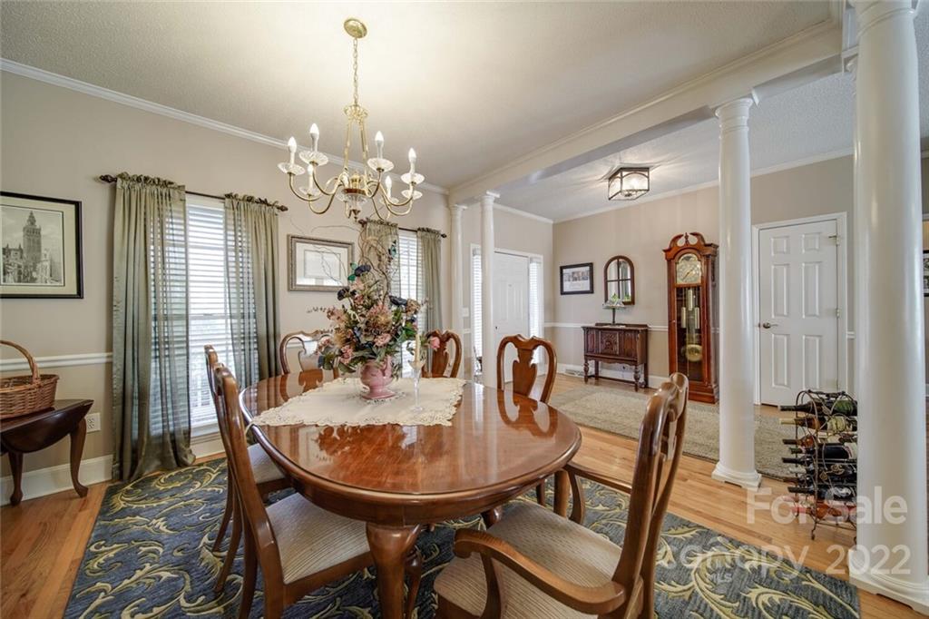 2700 Dutch Road Mount Pleasant, NC 28124 - Photo 7 of 48 a view of a dining room with furniture and chandelier
