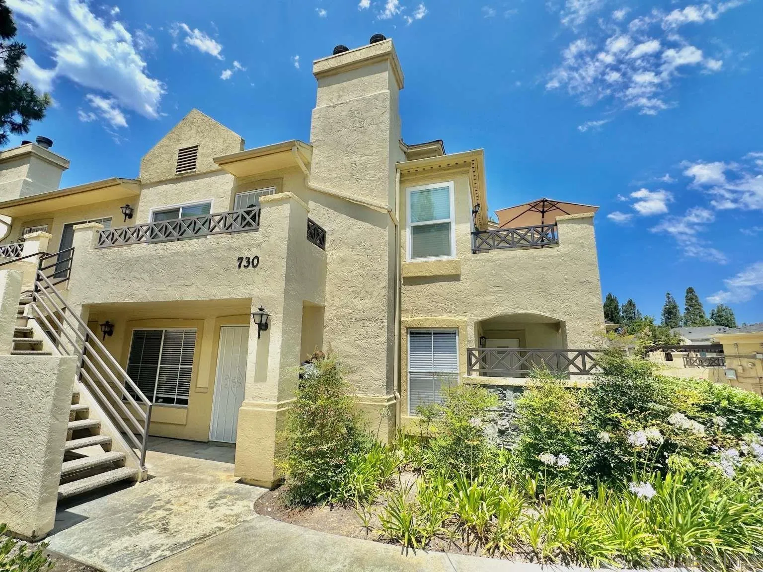 730 Brookstone Road, Unit 104 Chula Vista, CA 91913 - Photo 1 of 22 front view of a house with a yard