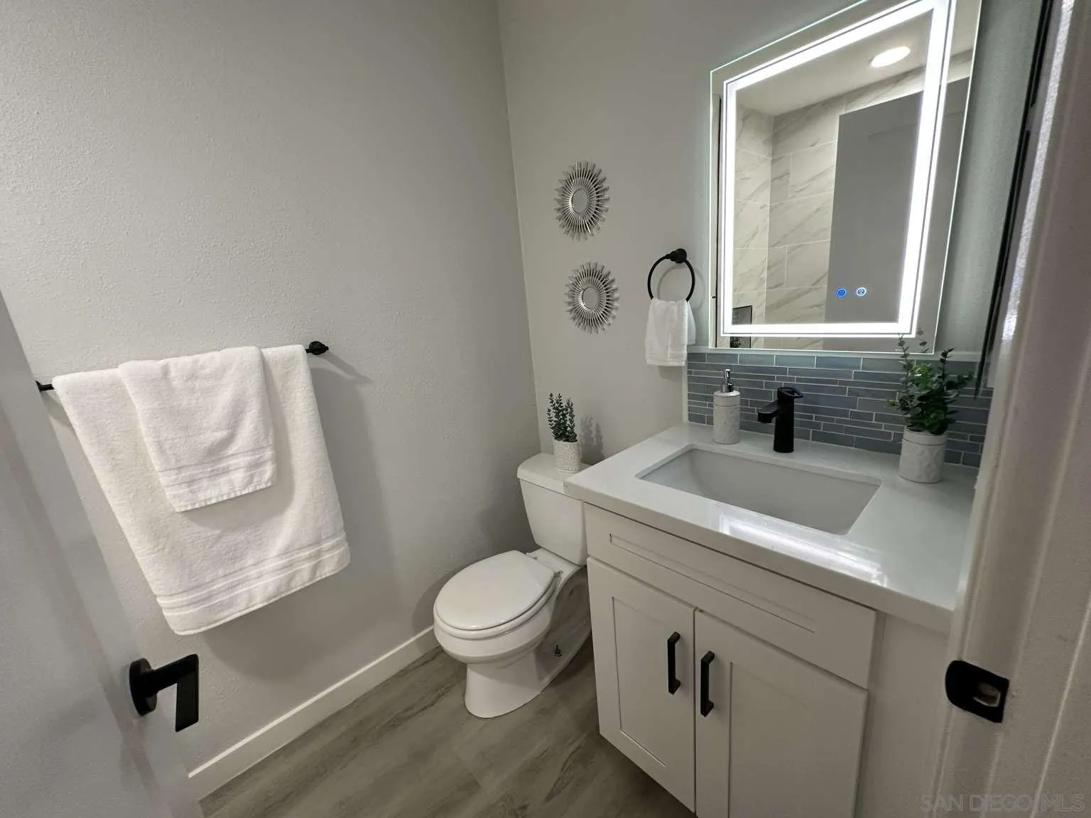 730 Brookstone Road, Unit 104 Chula Vista, CA 91913 - Photo 11 of 22 a bathroom with a toilet sink and mirror
