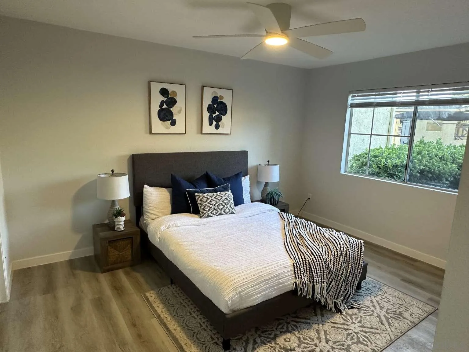 730 Brookstone Road, Unit 104 Chula Vista, CA 91913 - Photo 15 of 22 a bedroom with a bed and a couch