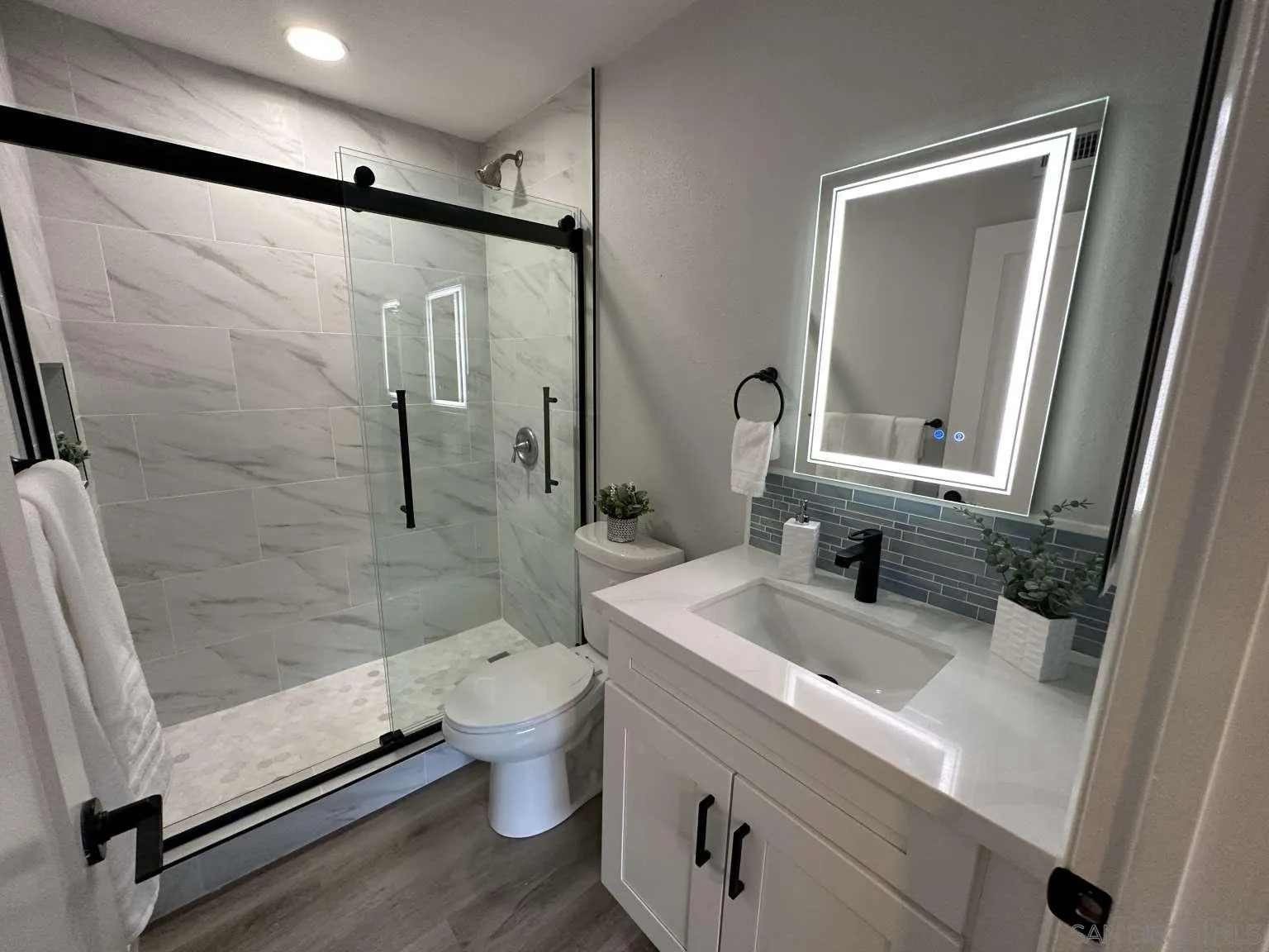730 Brookstone Road, Unit 104 Chula Vista, CA 91913 - Photo 19 of 22 a bathroom with a sink toilet and shower