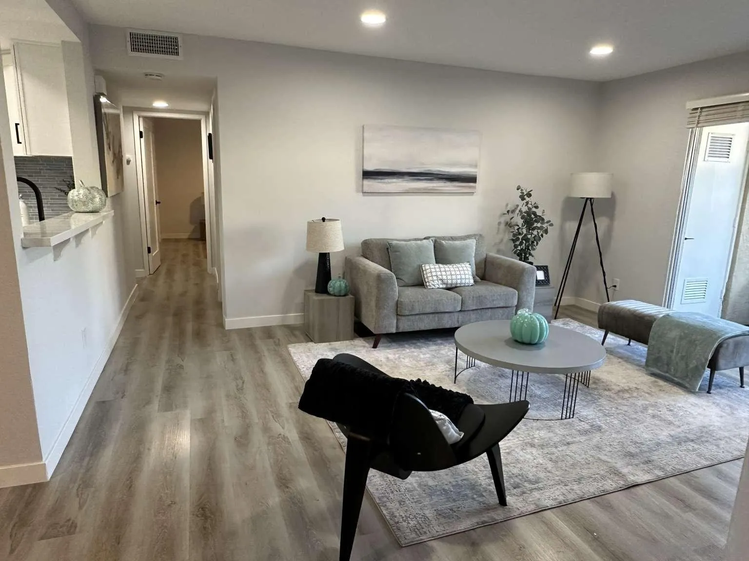 730 Brookstone Road, Unit 104 Chula Vista, CA 91913 - Photo 2 of 22 a living room with furniture and wooden floor