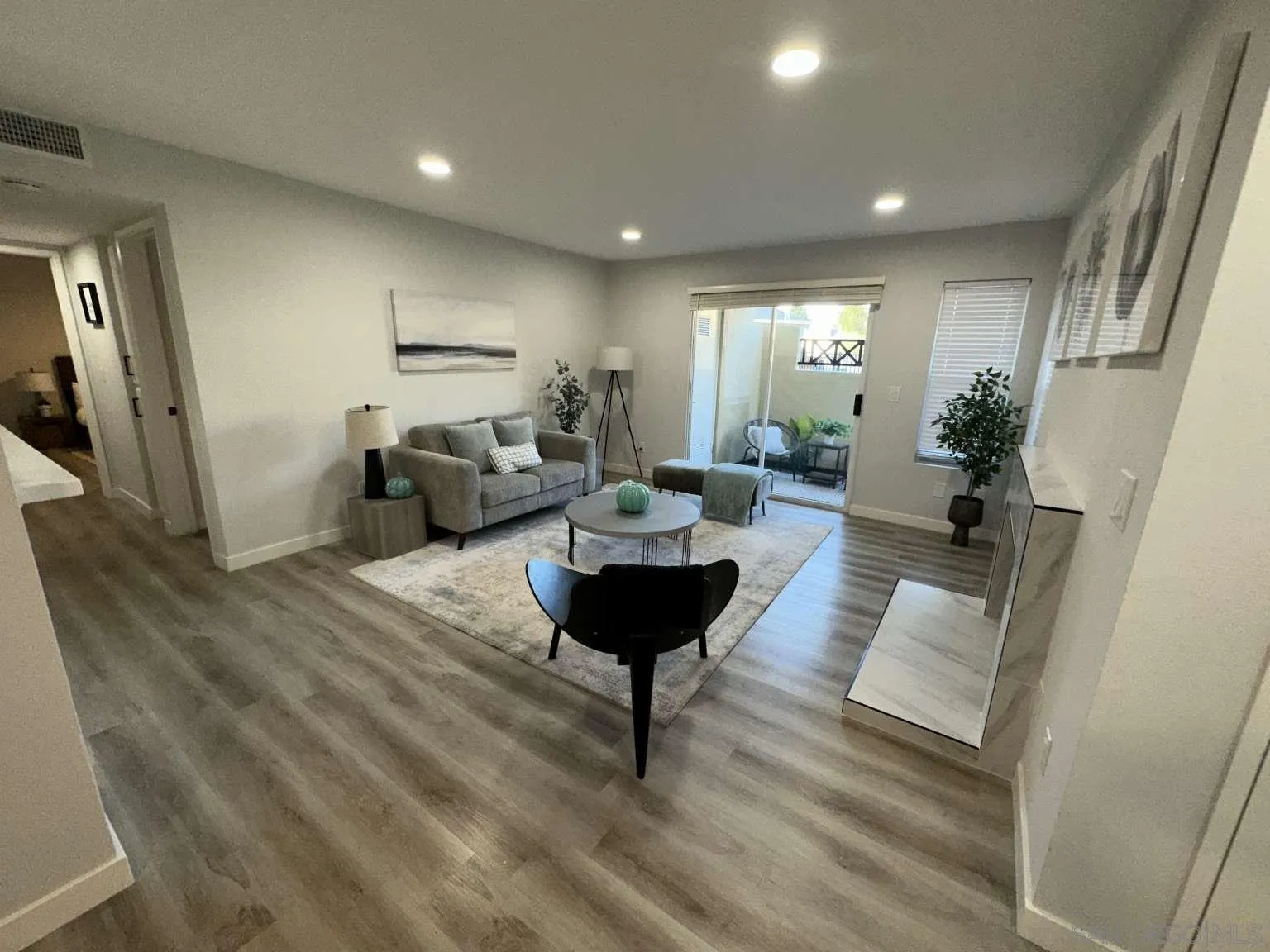 730 Brookstone Road, Unit 104 Chula Vista, CA 91913 - Photo 6 of 22 a living room with furniture and a glass door