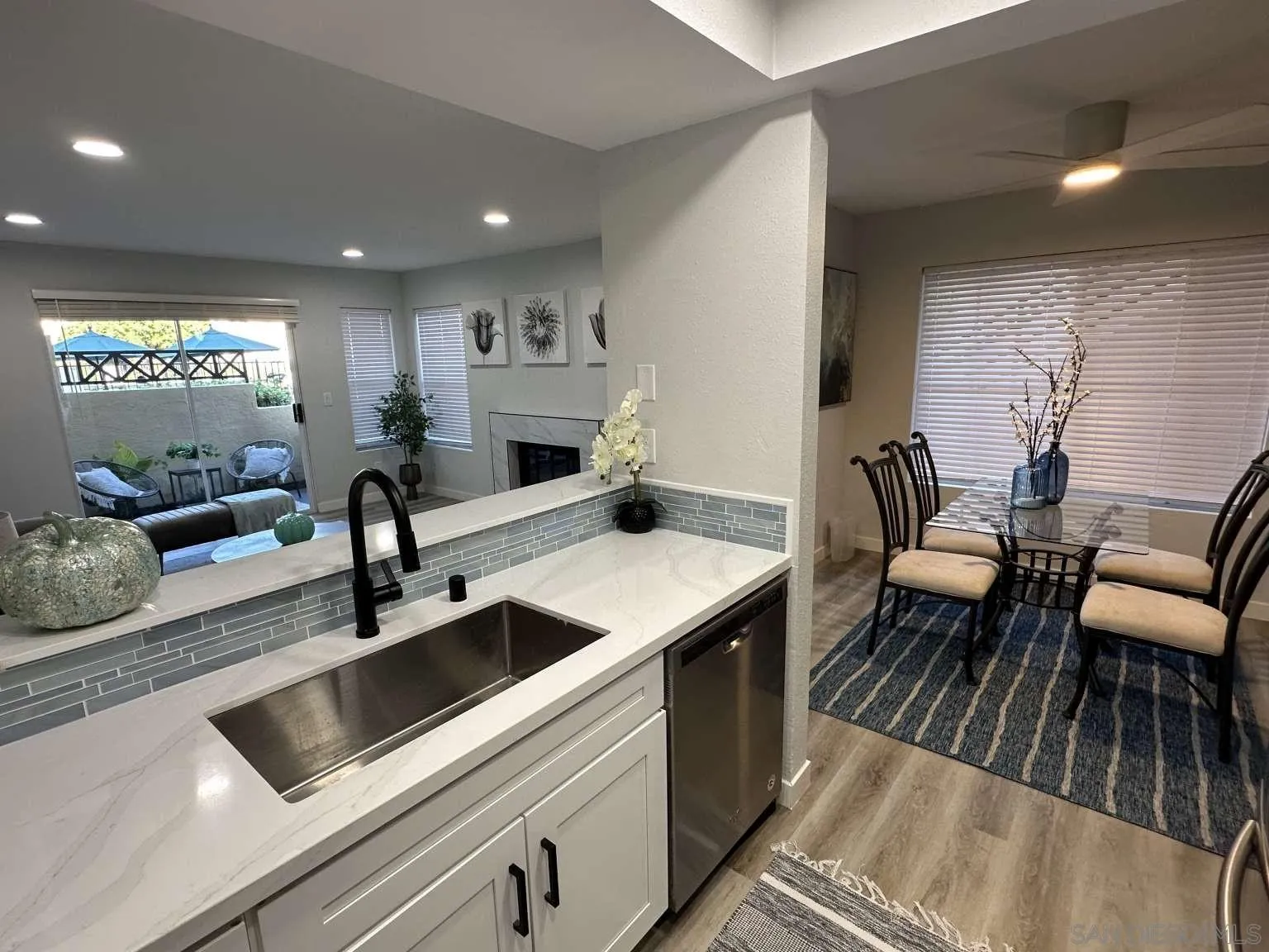 730 Brookstone Road, Unit 104 Chula Vista, CA 91913 - Photo 7 of 22 a kitchen with a table chairs and white appliances