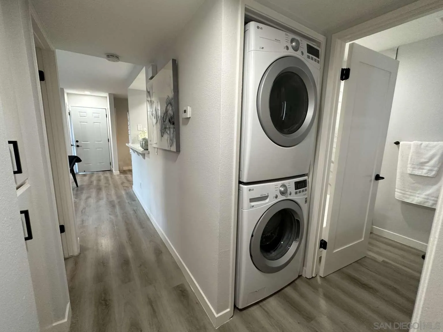 730 Brookstone Road, Unit 104 Chula Vista, CA 91913 - Photo 10 of 22 a view of a hallway with washer and dryer