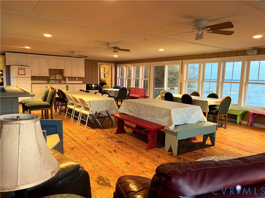 0 Glebe Landing Road Center Cross, VA 22437 - Photo 15 of 20 a living room with furniture a large window and kitchen view