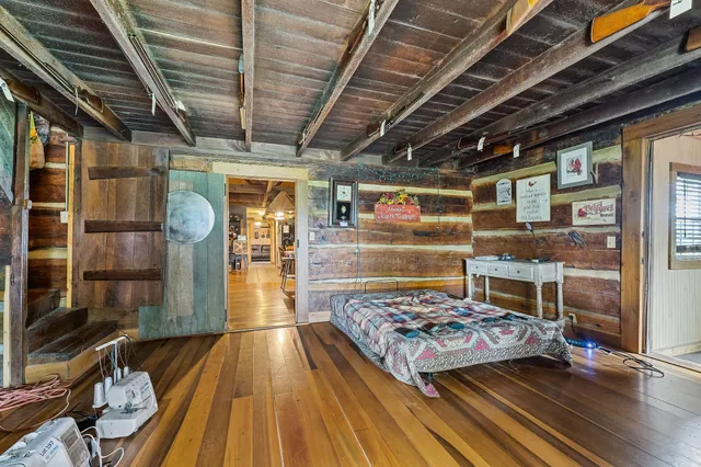 a living room with patio furniture and a fireplace