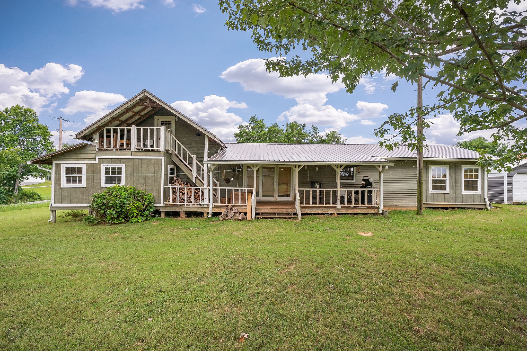 114 Ozone Road Monroe, TN 38573 - Photo 4 of 16 a front view of a house with a garden