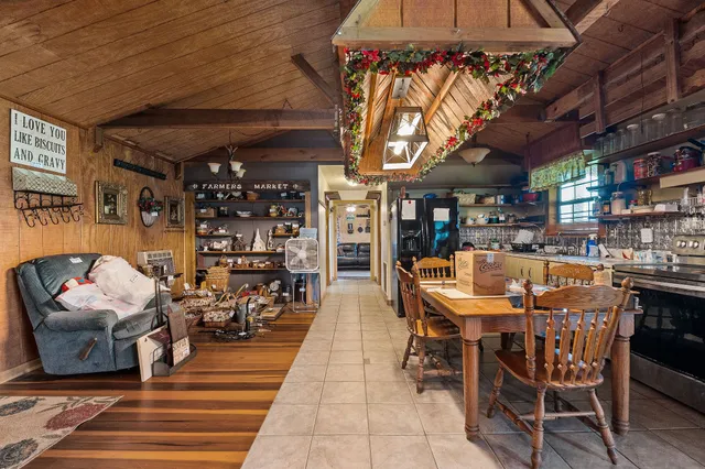 a outdoor space with lots of chairs and a chandelier