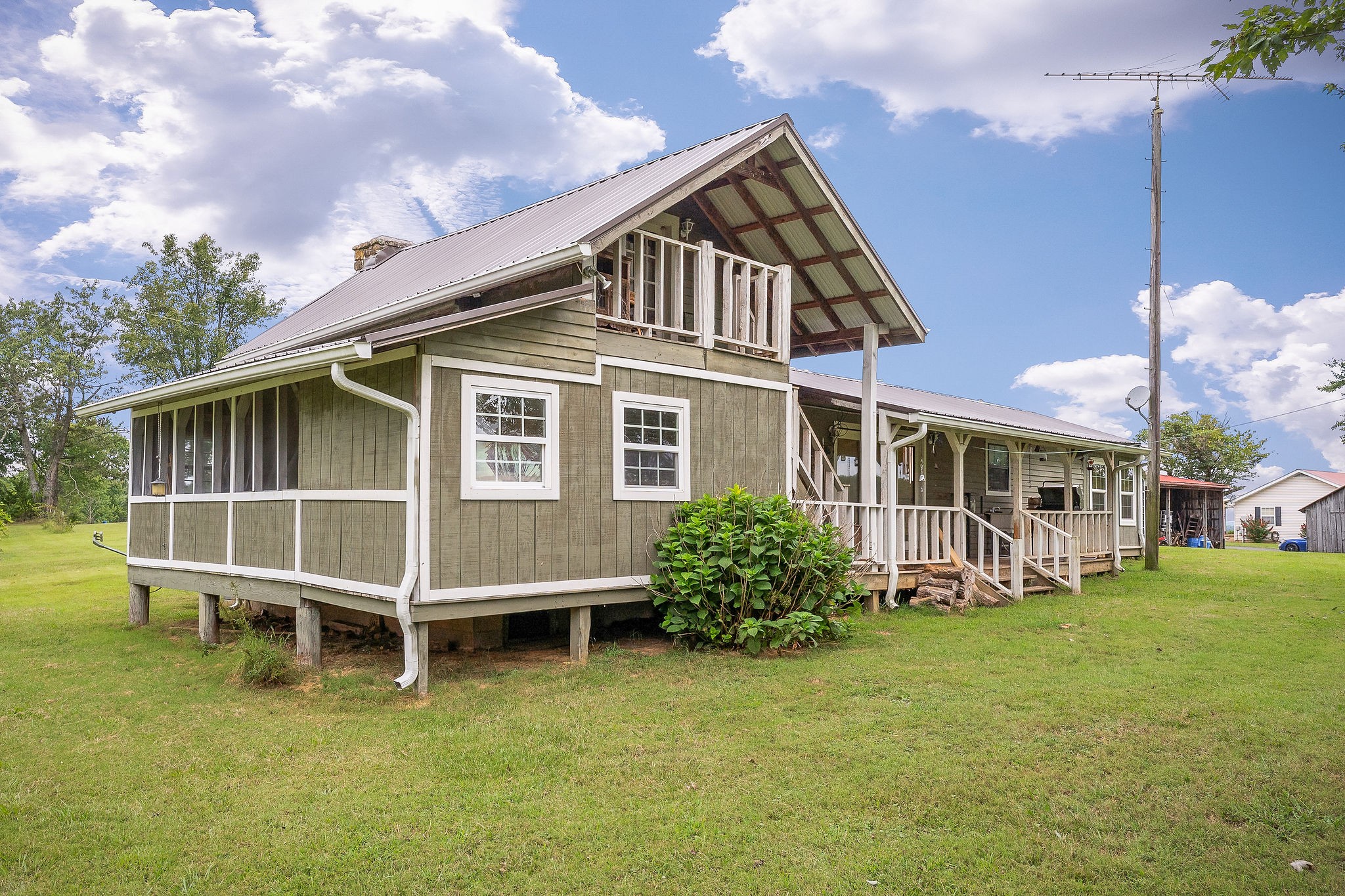 114 Ozone Road Monroe, TN 38573 - Photo 7 of 16 a view of a house with a yard and sitting area