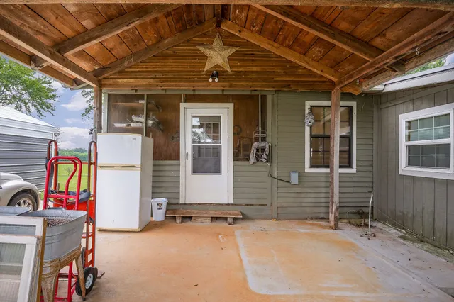 a view of a chairs and table in a patio