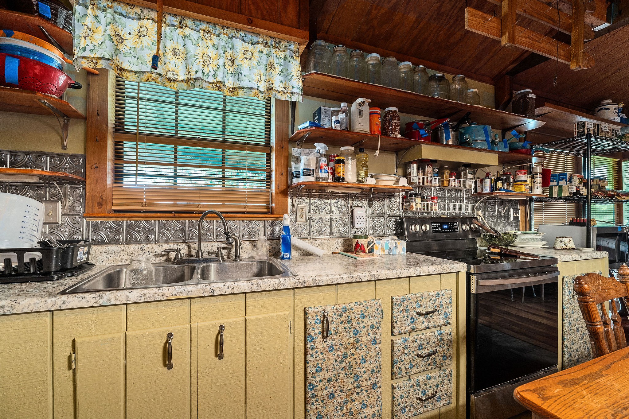 114 Ozone Road Monroe, TN 38573 - Photo 10 of 16 a kitchen with stainless steel appliances kitchen island granite countertop a sink and a stove