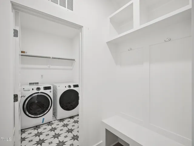 a view of a house with a yard and plants