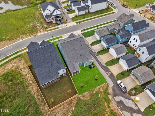 a view of a swimming pool with outdoor seating space