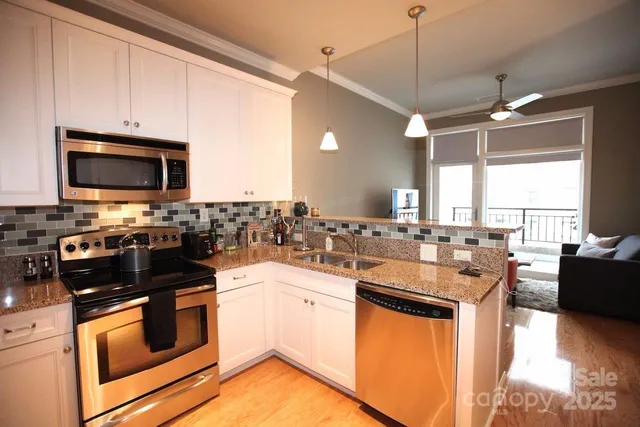 a kitchen with a sink stove and microwave