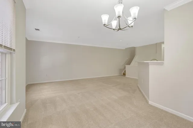 a kitchen with a refrigerator a stove a sink dishwasher and white cabinets with wooden floor