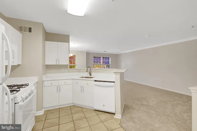 a view of kitchen with cabinets and wooden floor