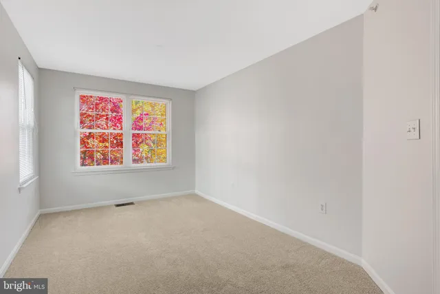 a bathroom with a toilet a sink a mirror a bathtub and vanity