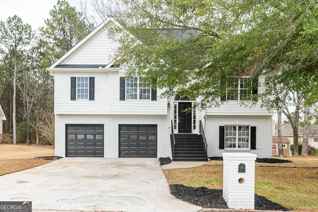 a front view of a house with yard