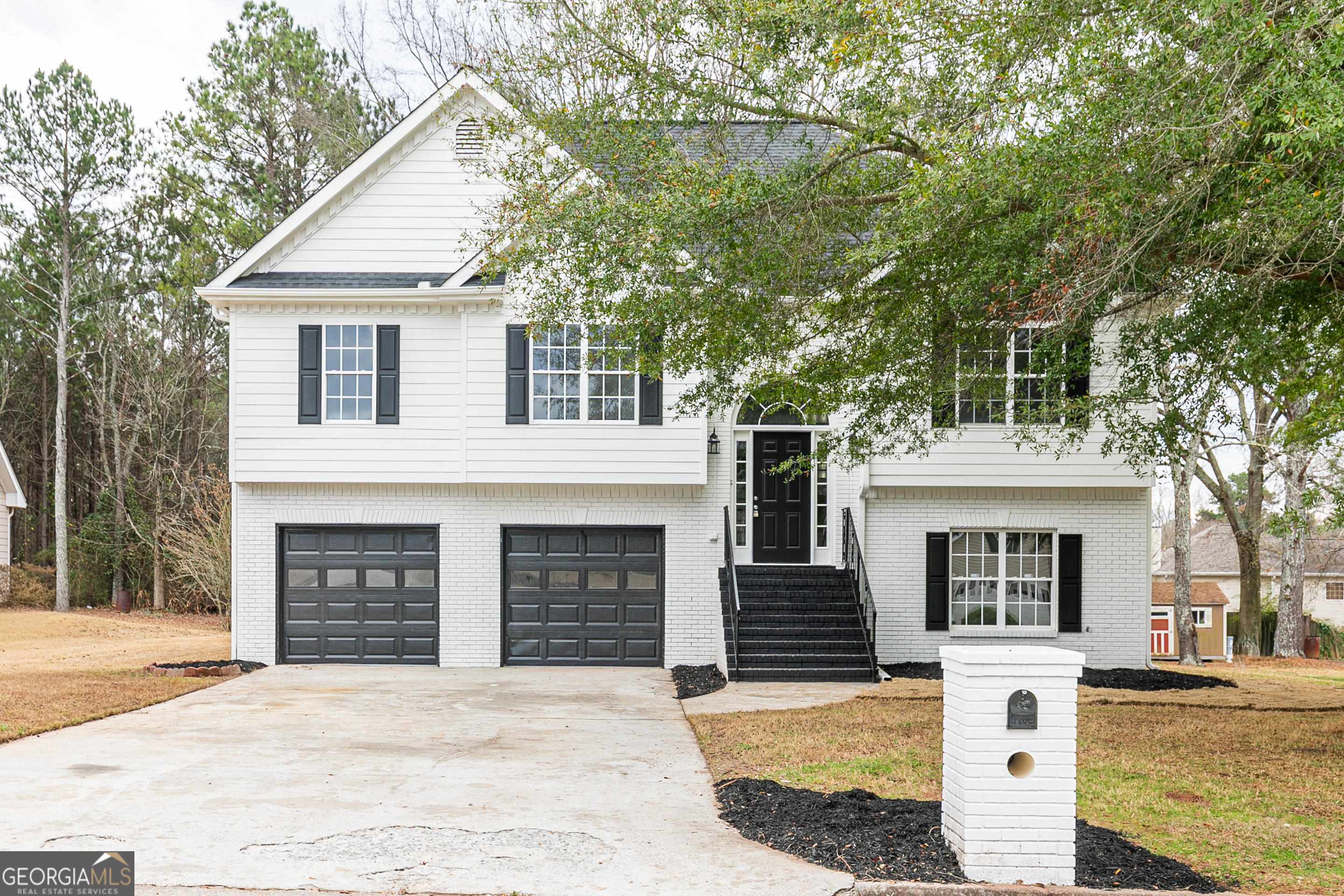 a front view of a house with yard