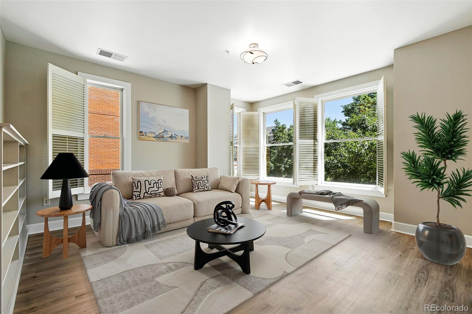 1631 Emerson Street, Unit 207 Denver, CO 80218 - Photo 5 of 31 a living room with furniture and a large window