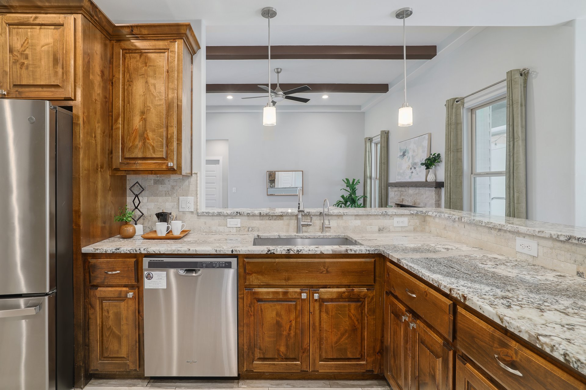 258 County Road Bastrop, TX 78602 - Photo 9 of 32 a kitchen with stainless steel appliances granite countertop a sink stove and refrigerator