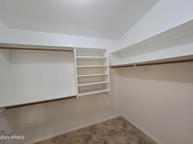 a view of an empty walk in closet