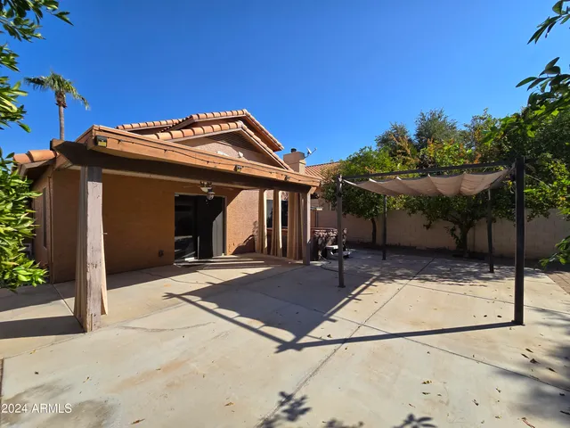 a view of a house with a iron gate