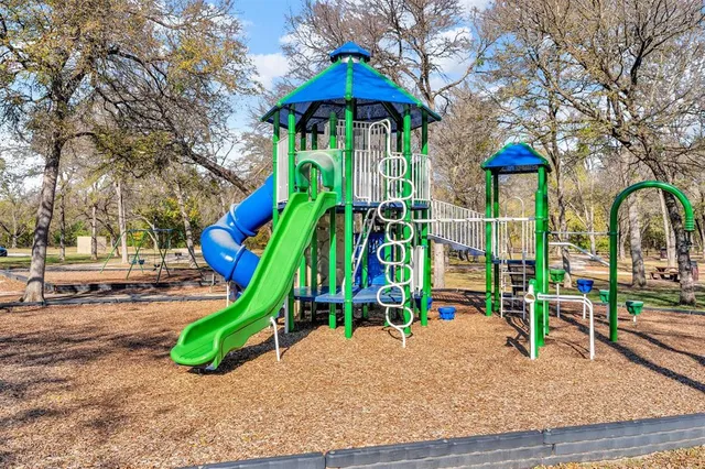 a view of a backyard of a house with a patio
