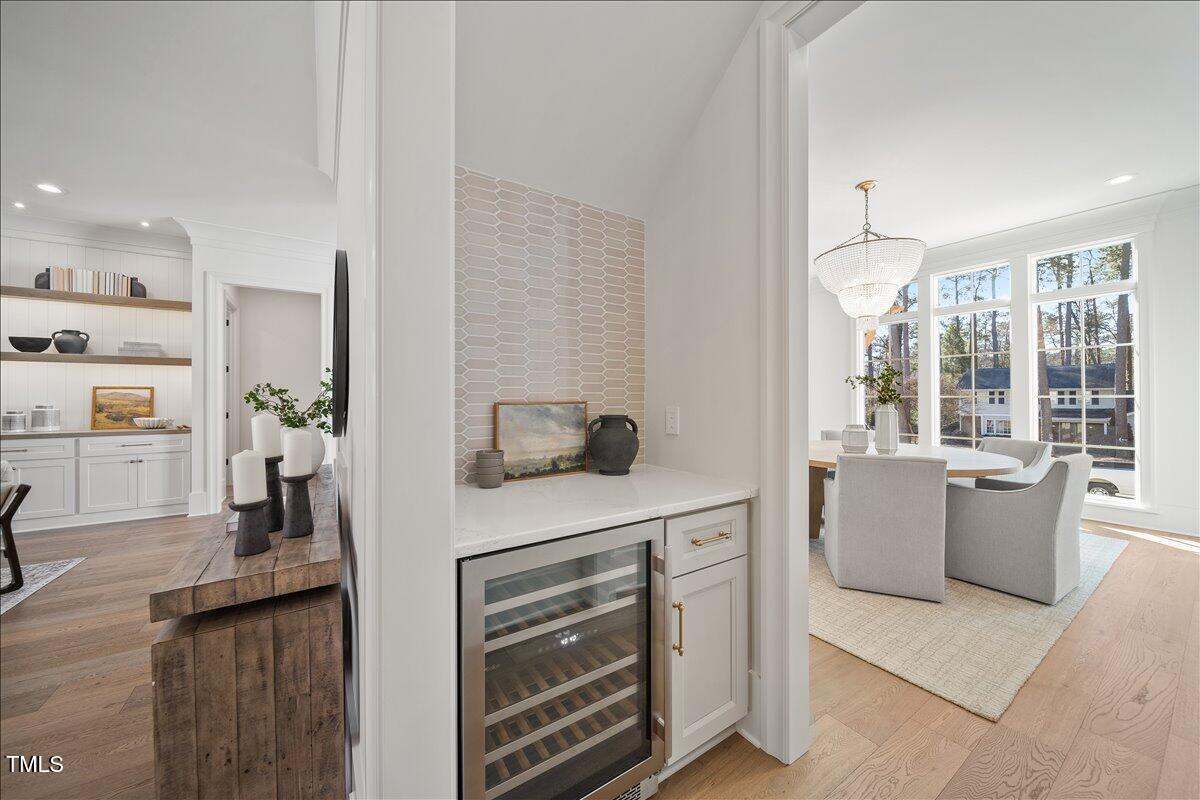 7516 Grist Mill Road Raleigh, NC 27615 - Photo 12 of 83 a kitchen with stainless steel appliances kitchen island granite countertop a stove a sink and a refrigerator