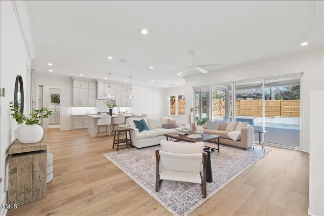 a kitchen with kitchen island granite countertop a sink and white appliances