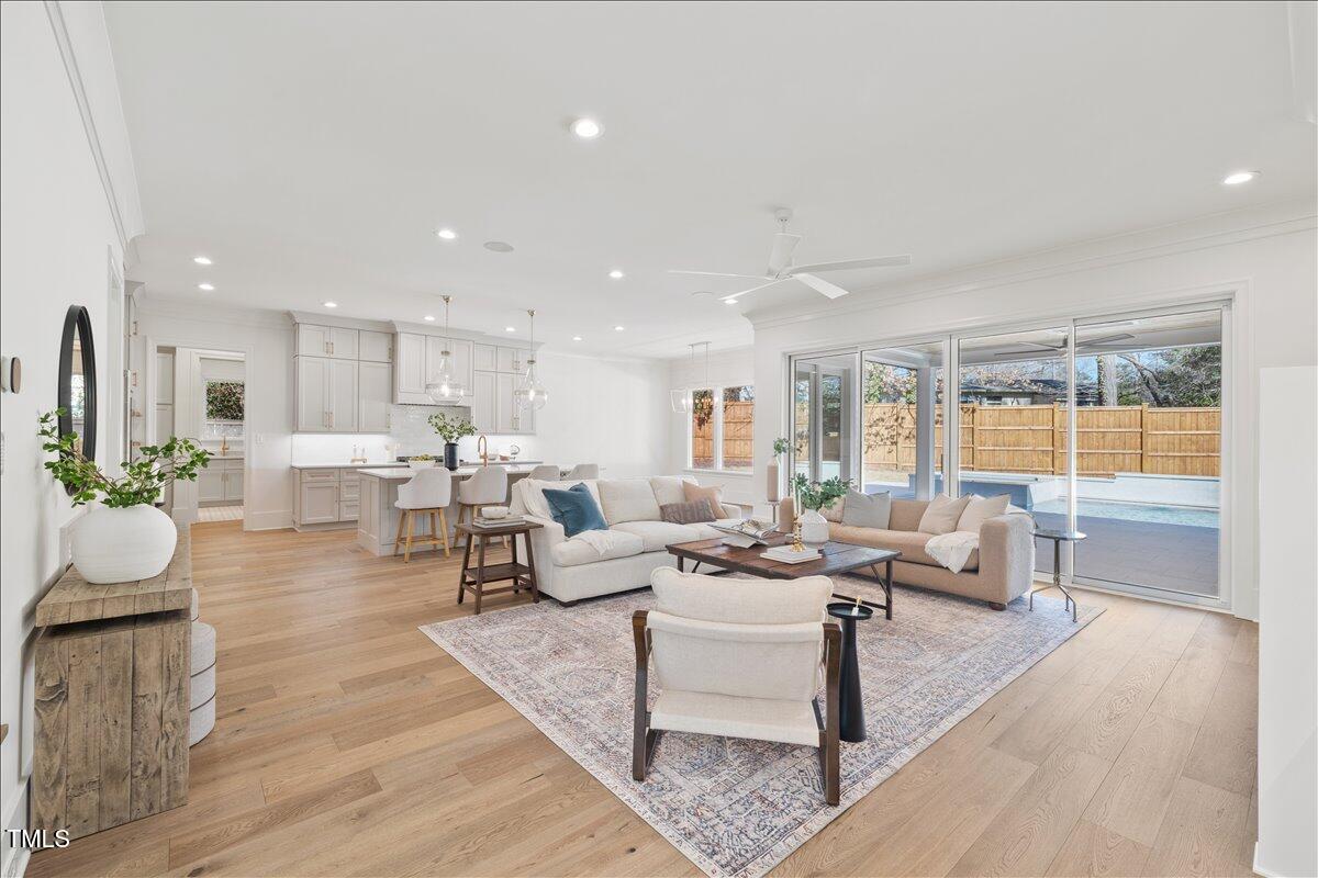7516 Grist Mill Road Raleigh, NC 27615 - Photo 13 of 83 a living room with furniture and a wooden floor