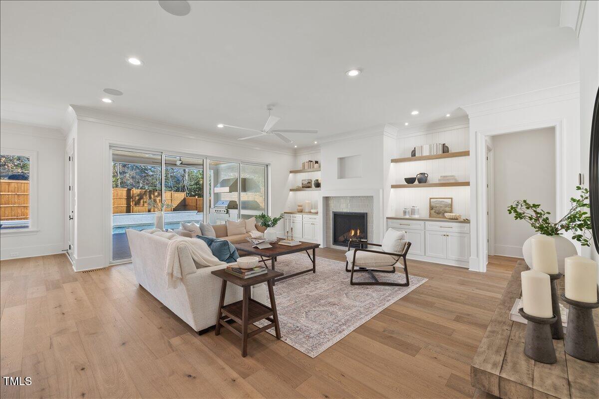 7516 Grist Mill Road Raleigh, NC 27615 - Photo 14 of 83 a living room with furniture fireplace and potted plant