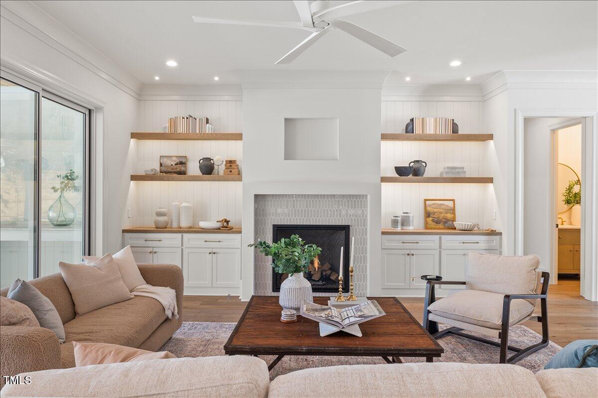 7516 Grist Mill Road Raleigh, NC 27615 - Photo 15 of 83 a living room with furniture and a fireplace