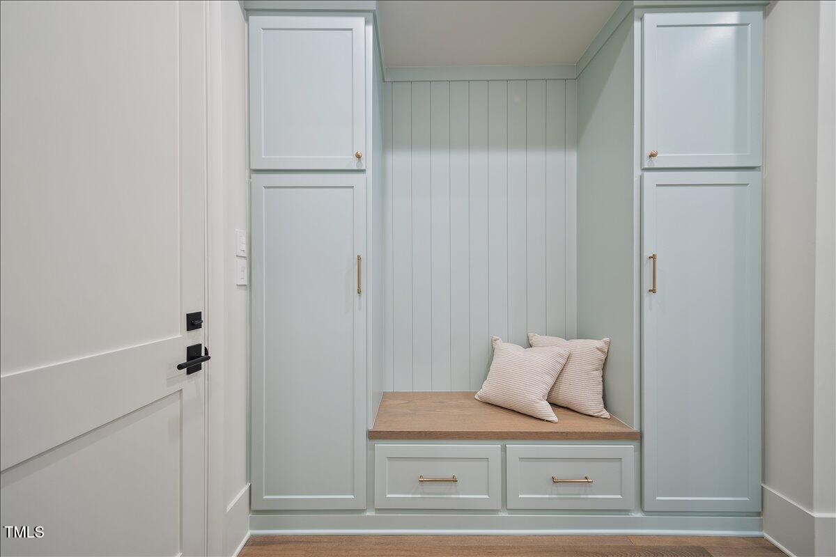 7516 Grist Mill Road Raleigh, NC 27615 - Photo 26 of 83 a view of bedroom with furniture and wooden floor