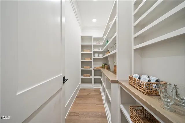 a bathroom with a bathtub shower sink and mirror