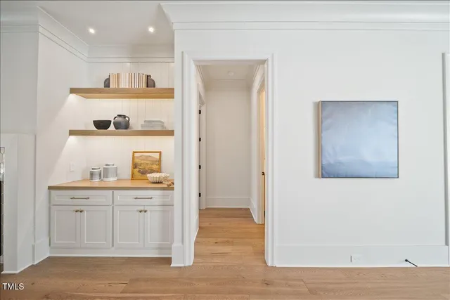 a living room with furniture and white walls