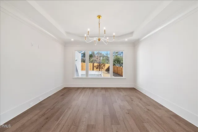 a bathroom with a light fixture a mirror and a shower