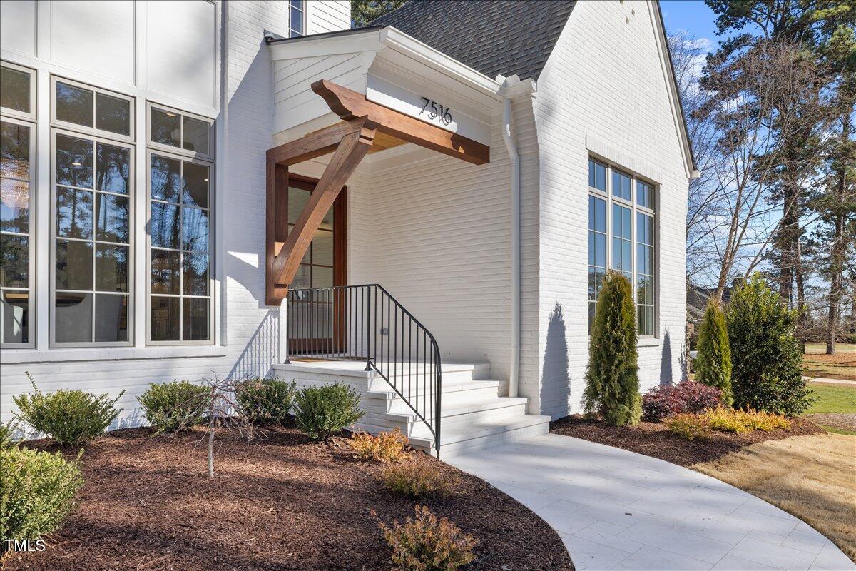 7516 Grist Mill Road Raleigh, NC 27615 - Photo 4 of 83 a view of a house with a yard