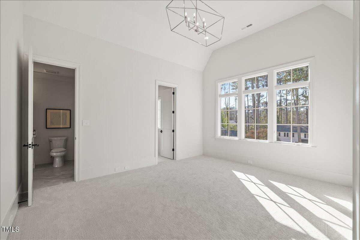7516 Grist Mill Road Raleigh, NC 27615 - Photo 48 of 83 a view of an empty room with a window