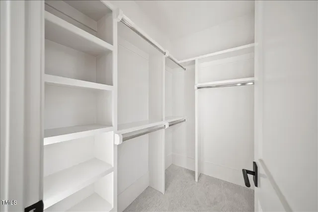 an aerial view of a house with a mountain