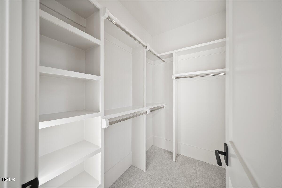 7516 Grist Mill Road Raleigh, NC 27615 - Photo 50 of 83 a view of an empty walk in closet