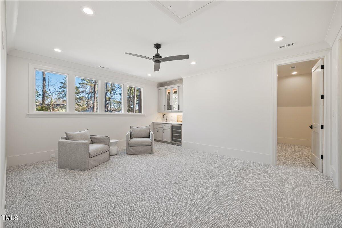 7516 Grist Mill Road Raleigh, NC 27615 - Photo 53 of 83 a living room with furniture and white walls